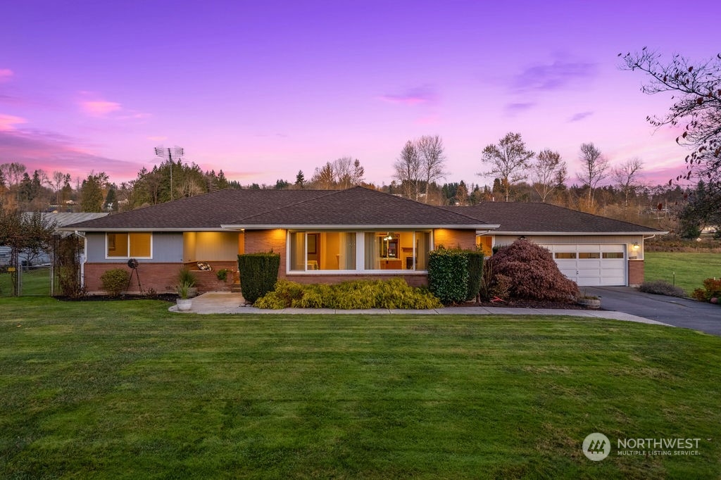 16303 Roosevelt Road Snohomish, WA 98290 - Photo 1 of 36 a view of a house with a big yard