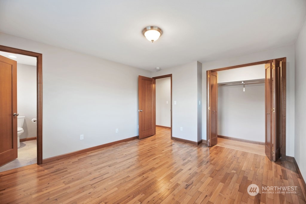 16303 Roosevelt Road Snohomish, WA 98290 - Photo 15 of 36 a view of an empty room with wooden floor and closet