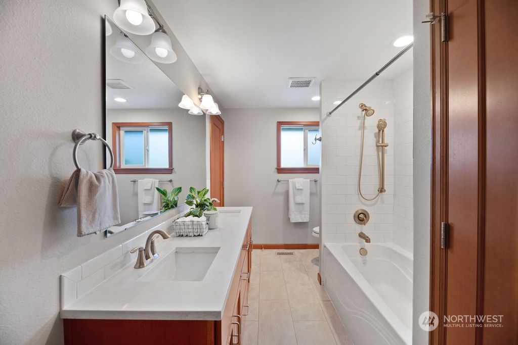 16303 Roosevelt Road Snohomish, WA 98290 - Photo 17 of 36 a bathroom with a tub sink and mirror