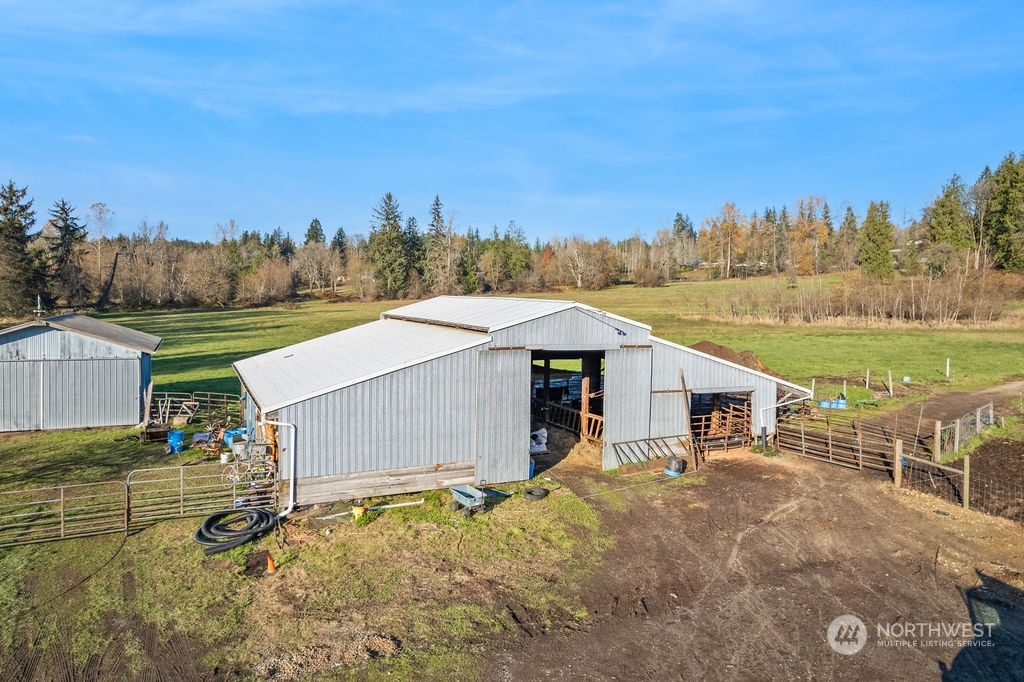 16303 Roosevelt Road Snohomish, WA 98290 - Photo 29 of 36 a view of a house with backyard and a garden