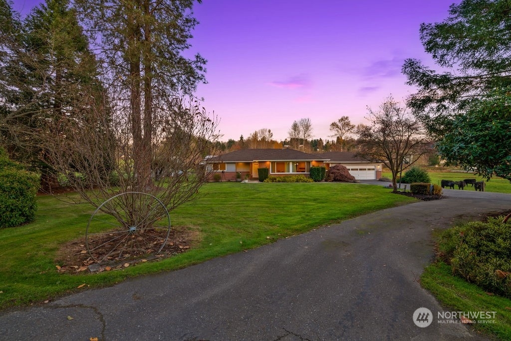 16303 Roosevelt Road Snohomish, WA 98290 - Photo 33 of 36 a view of a house with a yard