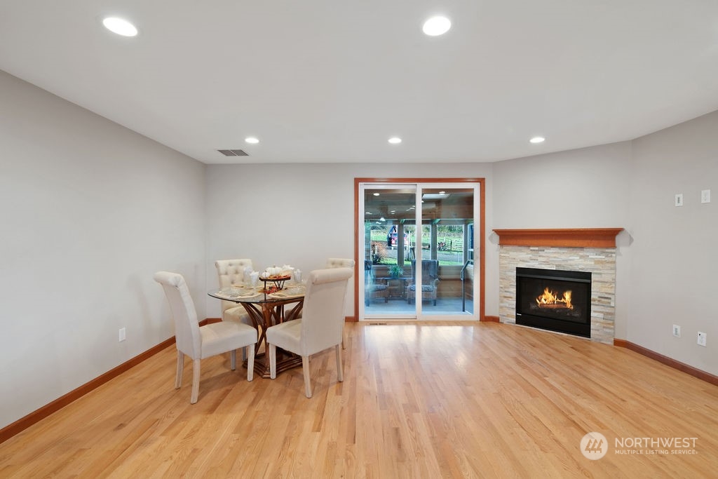 16303 Roosevelt Road Snohomish, WA 98290 - Photo 10 of 36 a dining room with furniture and fireplace
