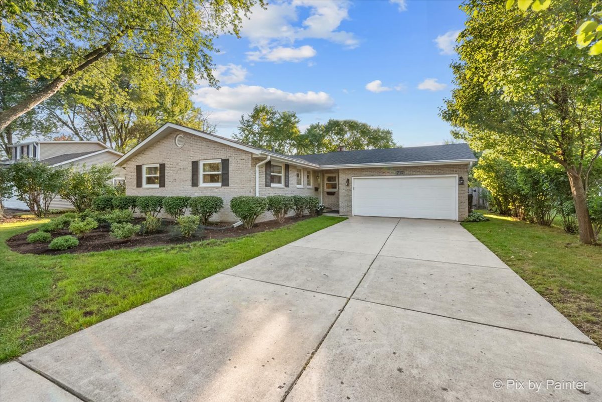 712 Aztec Drive Carol Stream, IL 60188 - Photo 2 of 40 a house view with a garden space