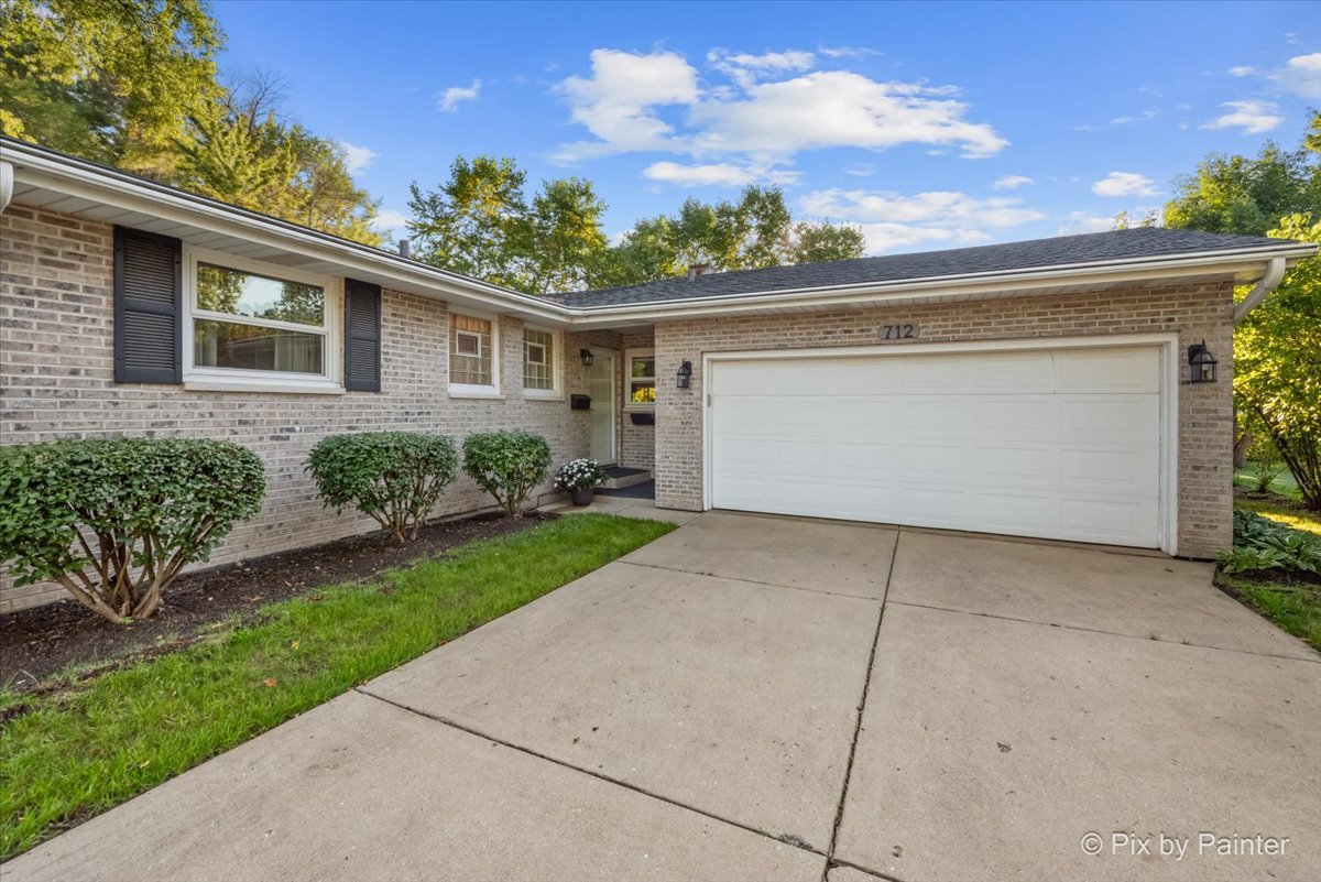 712 Aztec Drive Carol Stream, IL 60188 - Photo 25 of 40 front view of a house with a yard
