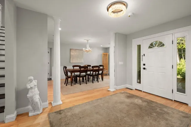 a view of a livingroom with furniture and a chandelier