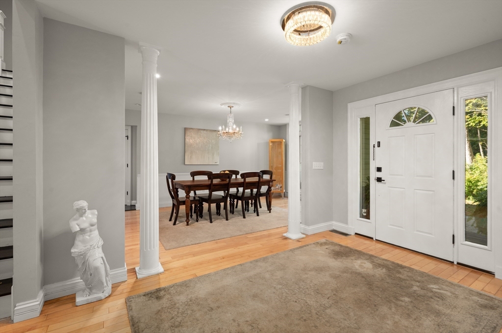 27 Turtle Back Road Essex, MA 01929 - Photo 13 of 40 a view of a livingroom with furniture and a chandelier