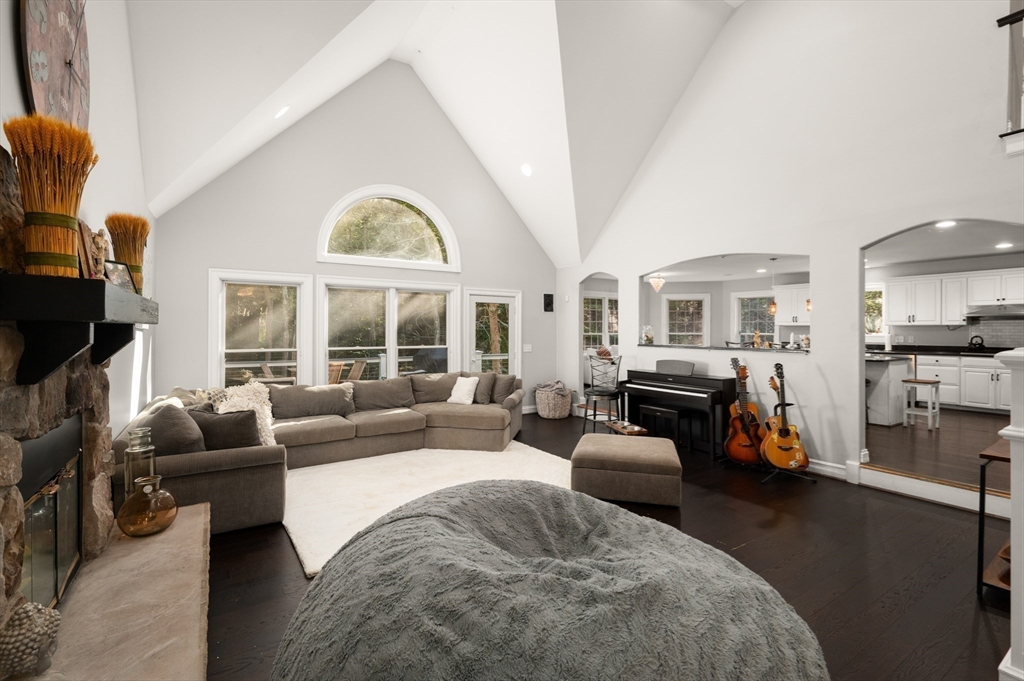27 Turtle Back Road Essex, MA 01929 - Photo 20 of 40 a living room with furniture a fireplace and a large window
