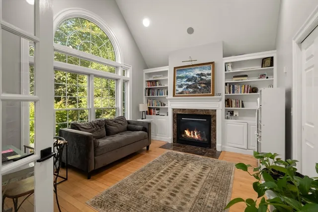 a balcony with table and chairs