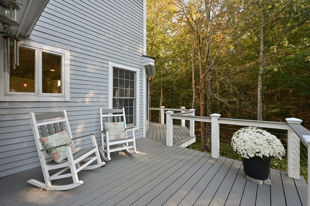 27 Turtle Back Road Essex, MA 01929 - Photo 32 of 40 a balcony with table and chairs
