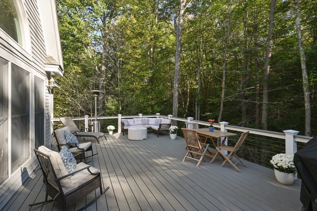 27 Turtle Back Road Essex, MA 01929 - Photo 36 of 40 a roof deck with a table and chairs