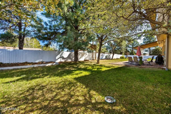 a view of backyard with sitting area