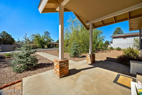 a view of swimming pool with a patio