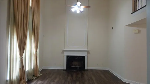 a view of hallway with wooden floor