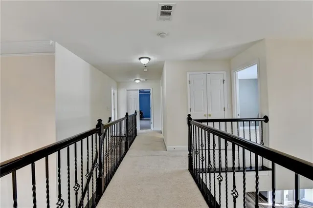 a bathroom with a double vanity sink mirror and shower
