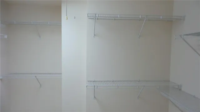 a view of a hallway with stairs