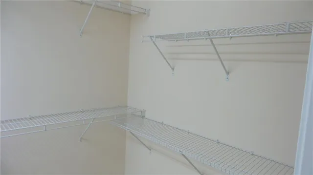 a view of a staircase with wooden floor and a window