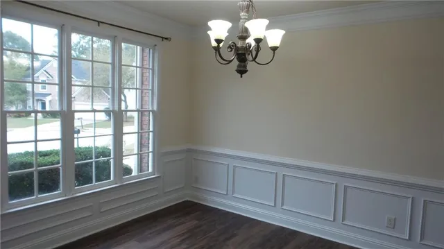 a kitchen with stainless steel appliances kitchen island granite countertop a sink and a refrigerator