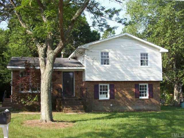 2908 Wicklow Place Raleigh, NC 27604 - Photo 1 of 1 a front view of a house with a yard
