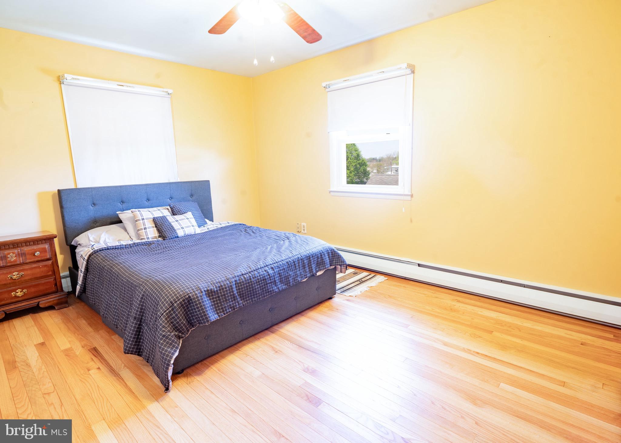 104 Rose Court Reading, PA 19607 - Photo 13 of 28 a spacious bedroom with a bed and a window