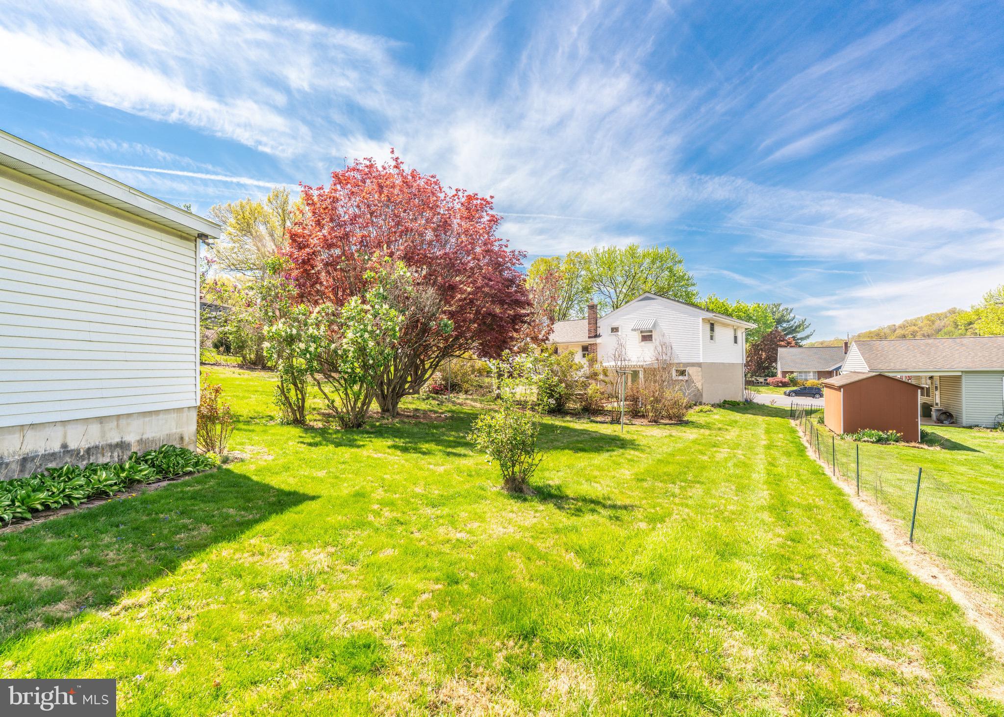 104 Rose Court Reading, PA 19607 - Photo 24 of 28 a swimming pool with yard and wooden fence