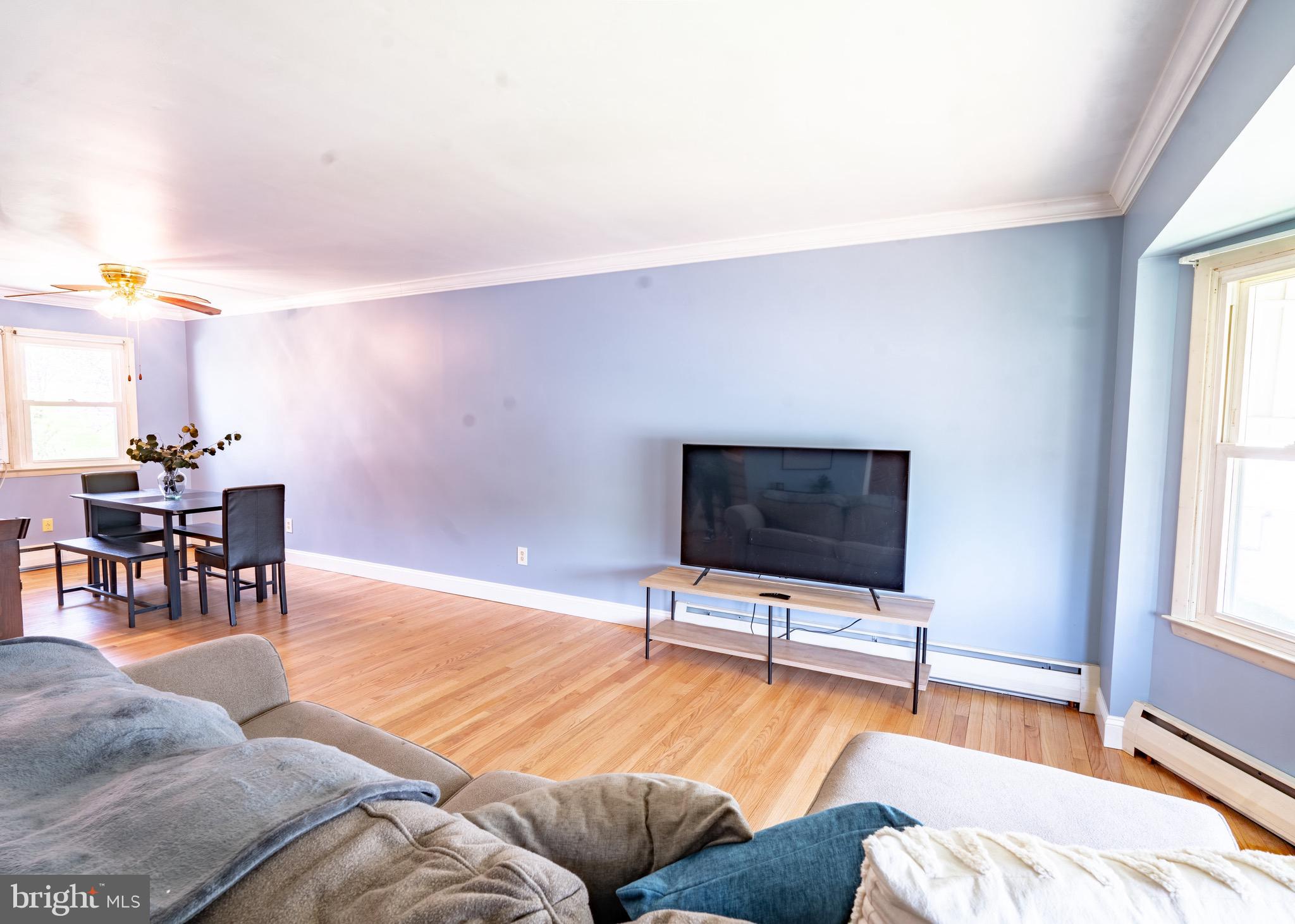 104 Rose Court Reading, PA 19607 - Photo 5 of 28 a living room with furniture and a flat screen tv