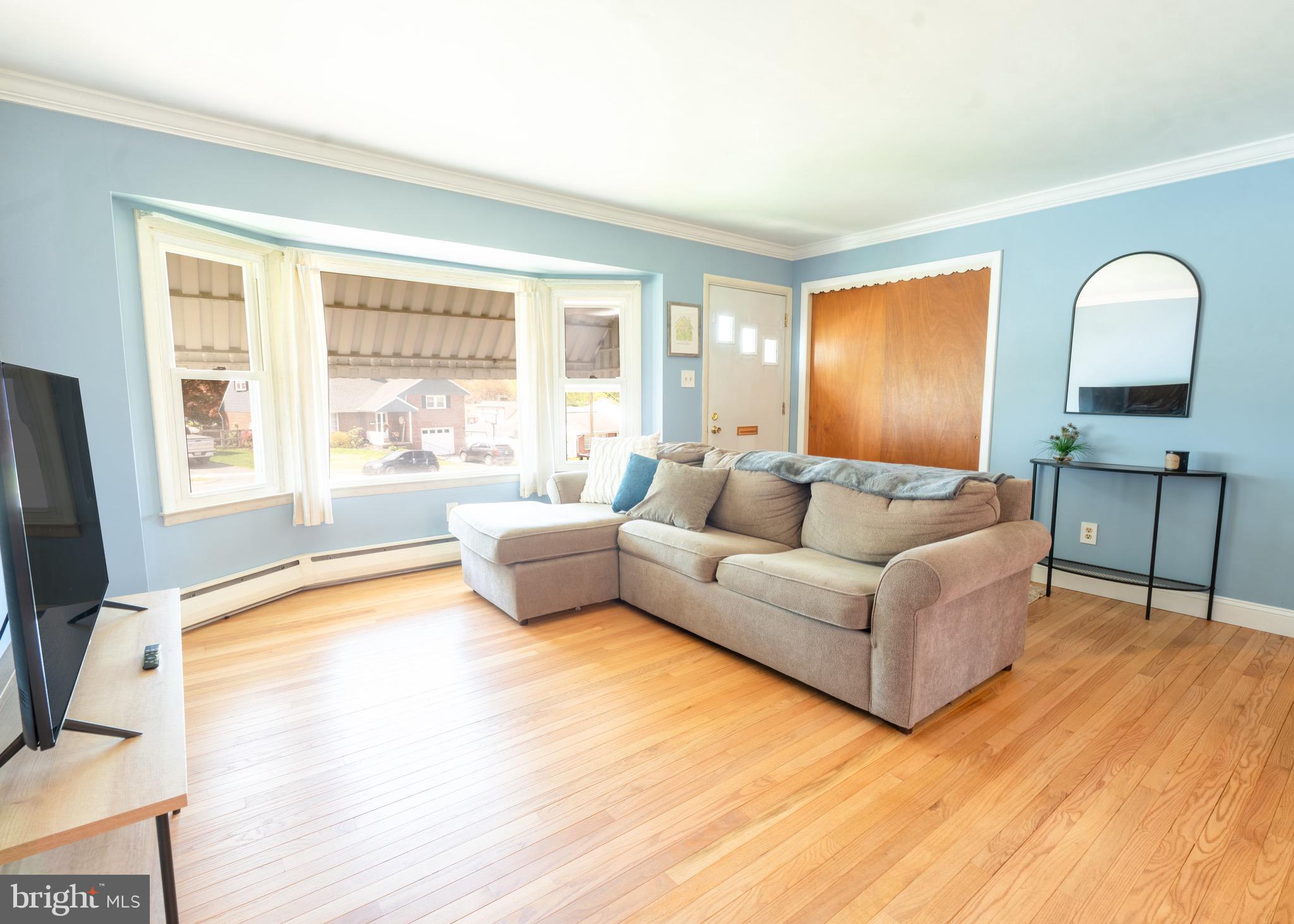 104 Rose Court Reading, PA 19607 - Photo 6 of 28 a living room with furniture and a large window