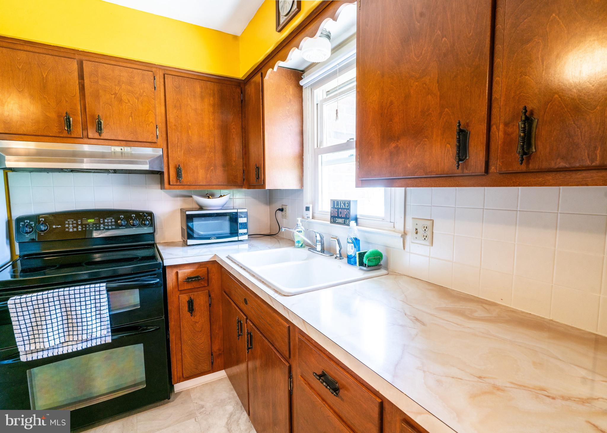104 Rose Court Reading, PA 19607 - Photo 9 of 28 a kitchen with a sink and a stove top oven