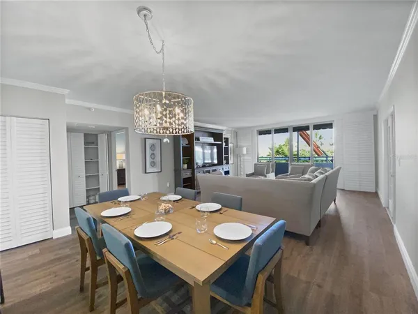 a view of a dining room with a table and chairs