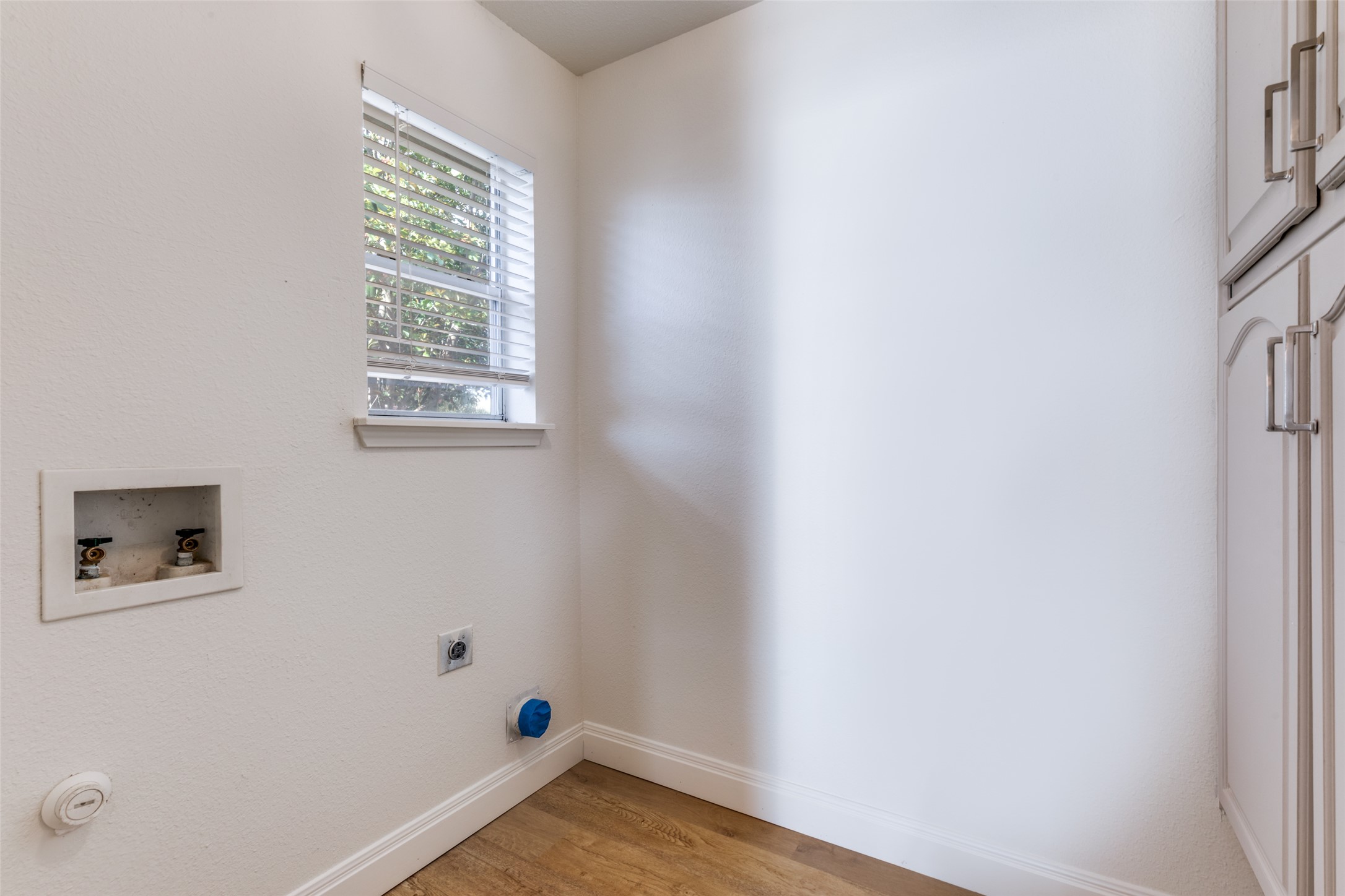 109 Orange Tree Lane Georgetown, TX 78626 - Photo 12 of 25 a view of a small space with wooden floor and a window