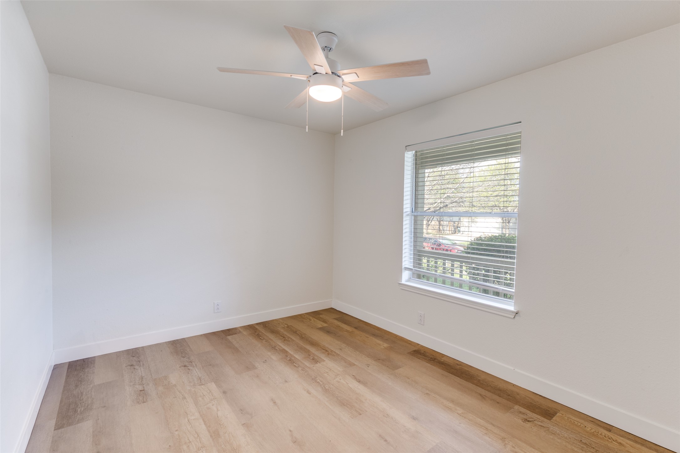 109 Orange Tree Lane Georgetown, TX 78626 - Photo 13 of 25 an empty room with a window and a ceiling fan