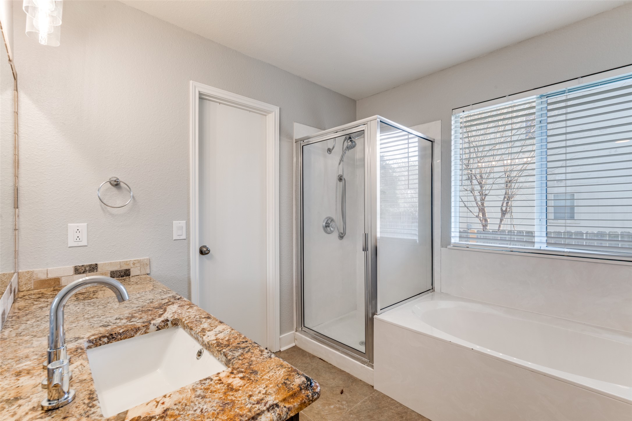 109 Orange Tree Lane Georgetown, TX 78626 - Photo 15 of 25 a bathroom with a tub sink and mirror
