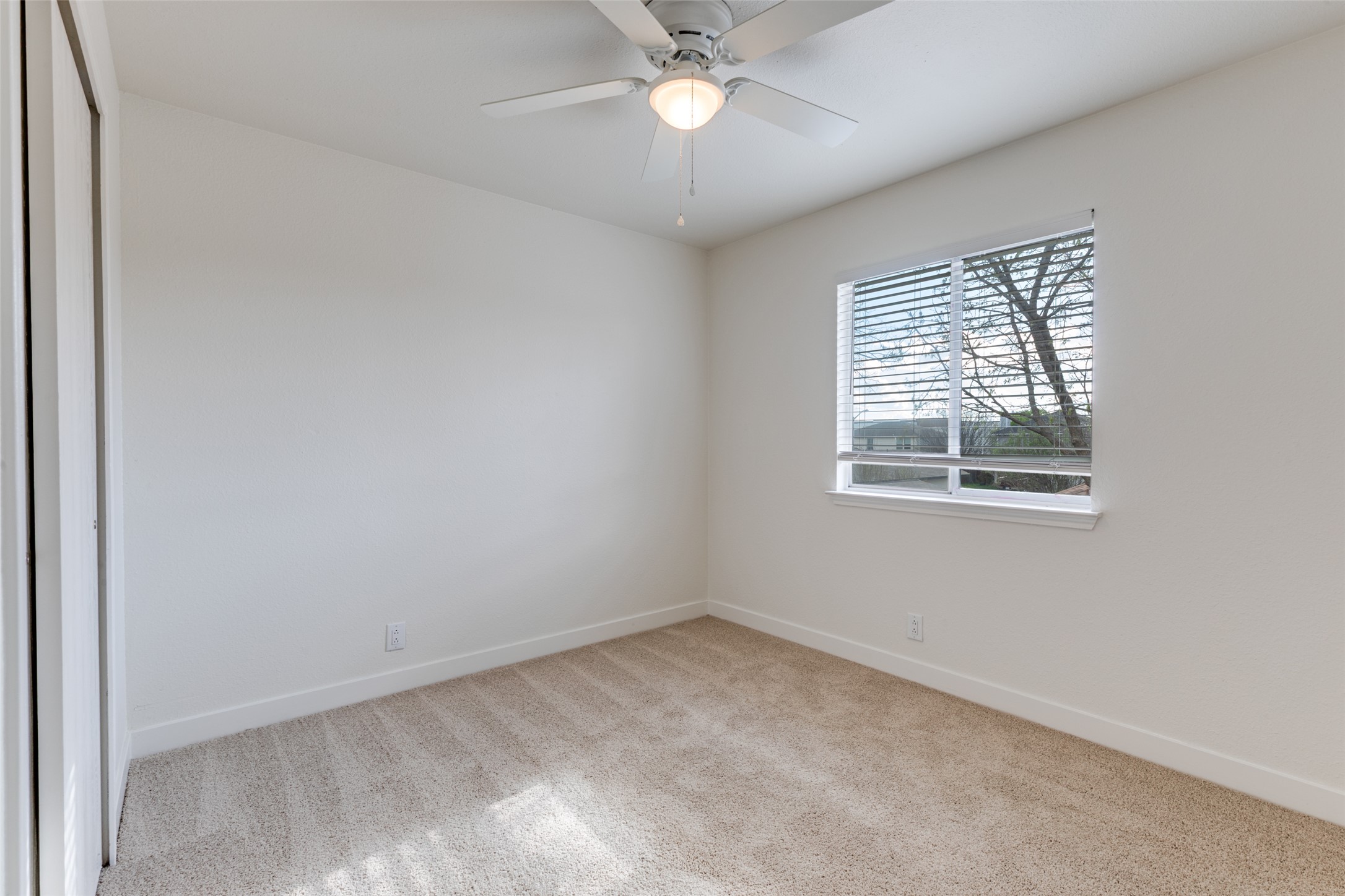 109 Orange Tree Lane Georgetown, TX 78626 - Photo 18 of 25 an empty room with a window and a fan