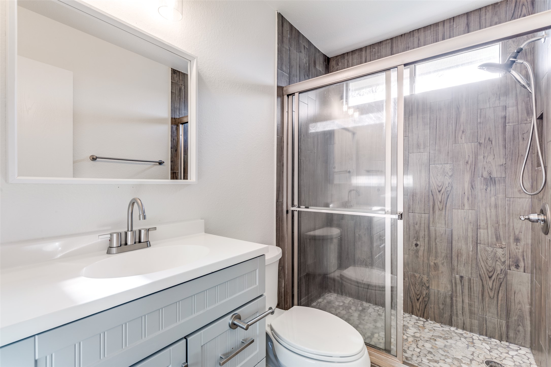 109 Orange Tree Lane Georgetown, TX 78626 - Photo 21 of 25 a bathroom with a sink a mirror a toilet and shower