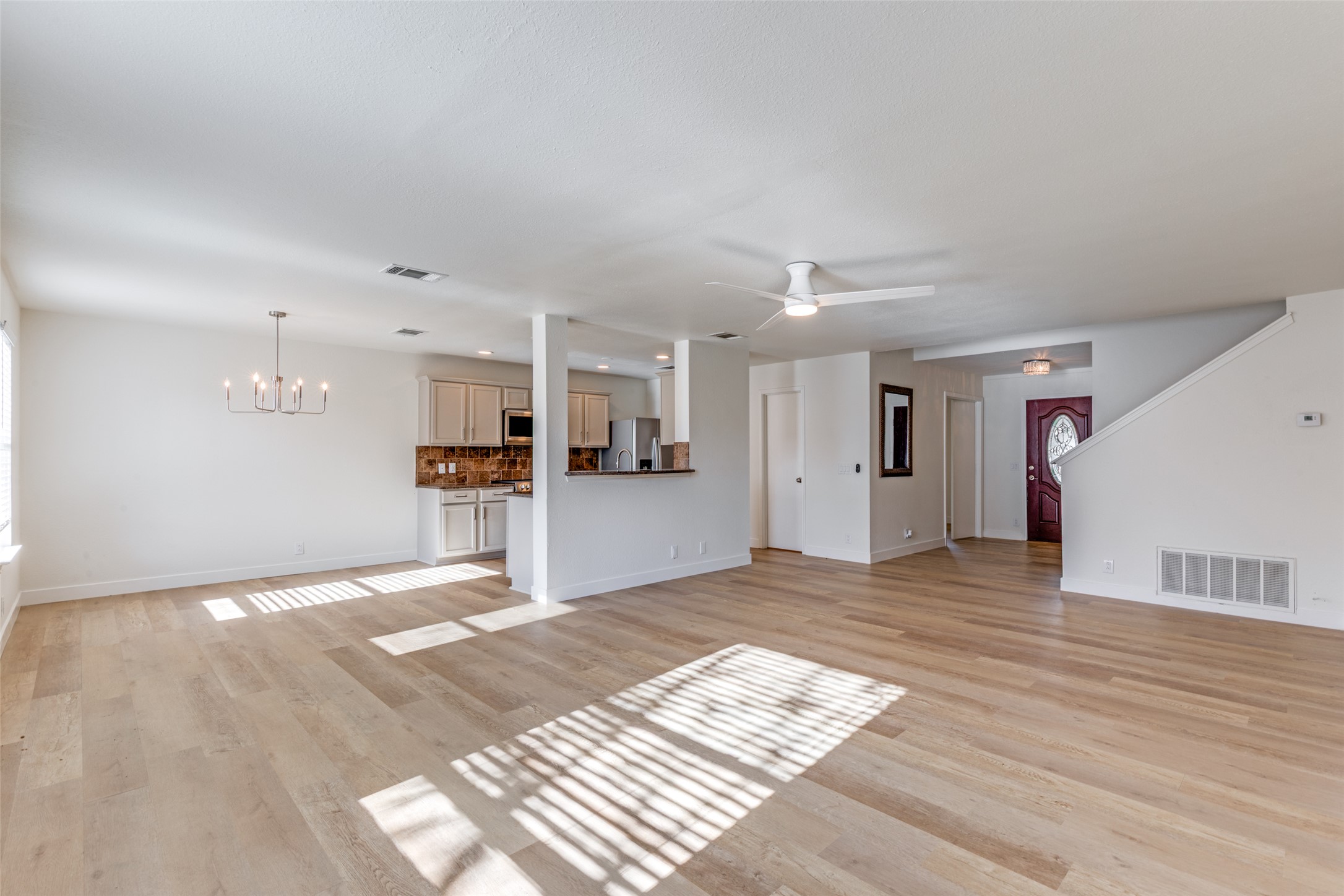 109 Orange Tree Lane Georgetown, TX 78626 - Photo 3 of 25 a view of a kitchen with wooden floor and a kitchen