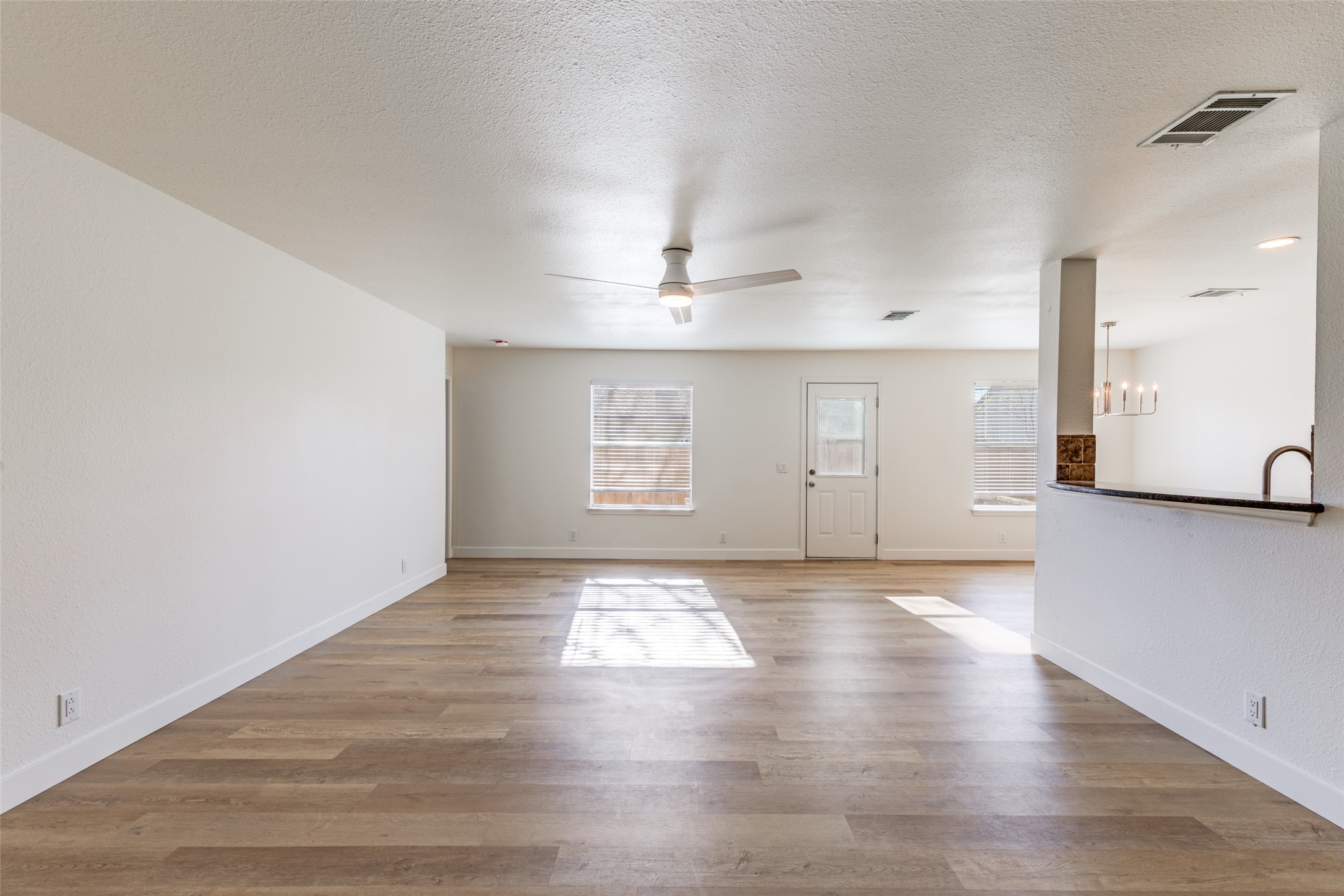 109 Orange Tree Lane Georgetown, TX 78626 - Photo 5 of 25 a view of an empty room with window and wooden floor