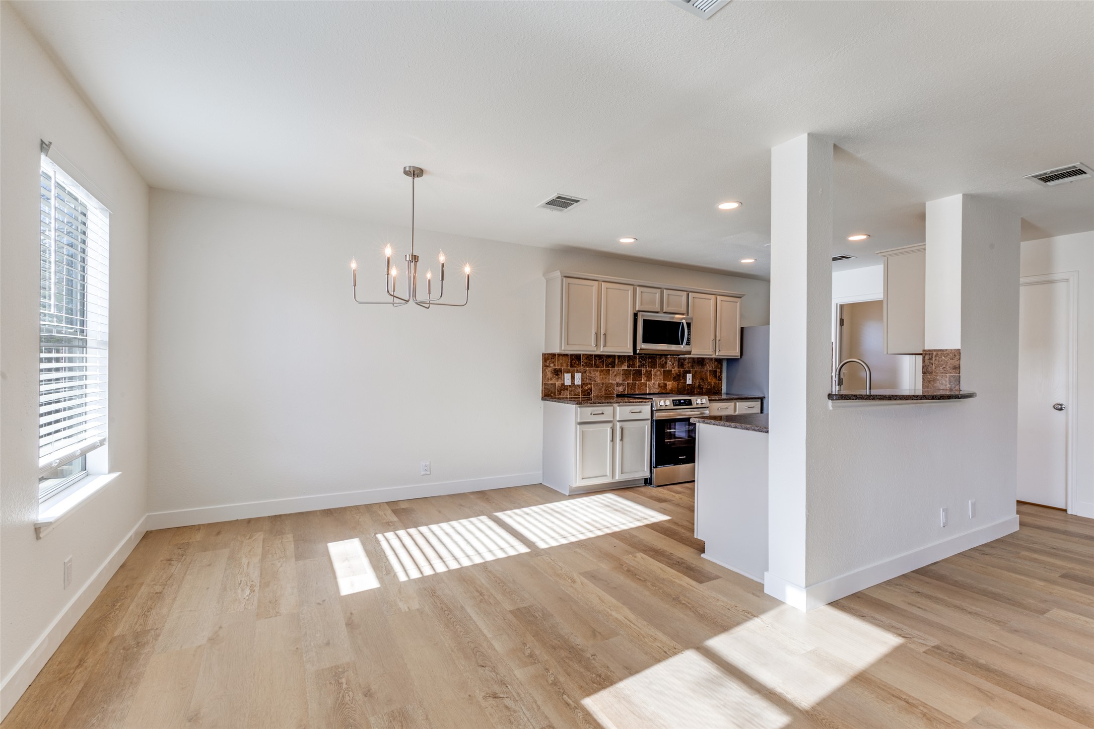 109 Orange Tree Lane Georgetown, TX 78626 - Photo 6 of 25 a view of kitchen with granite countertop stainless steel appliances and a window