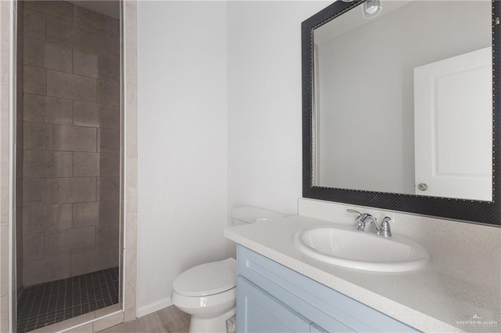 340 Eva Street, Unit 2 Elsa, TX 78543 - Photo 11 of 12 a bathroom with a sink and a toilet