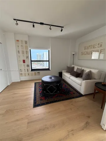 a bathroom with a double vanity sink and mirror with shower