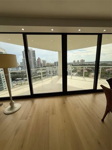 a bedroom with furniture and wooden floor