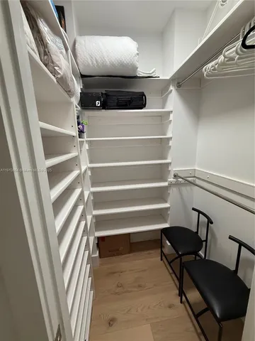 a view of swimming pool with a chairs