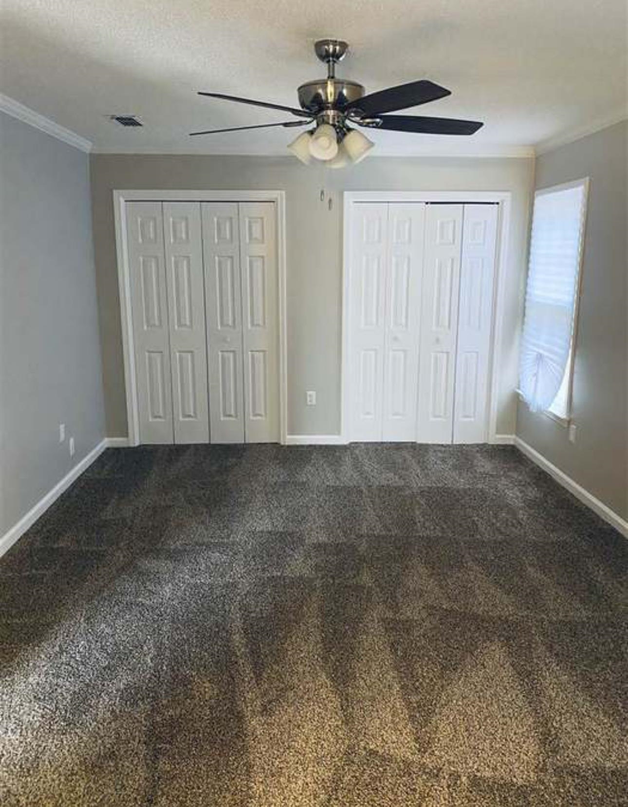 7001 Rockingham Road Memphis, TN 38125 - Photo 8 of 9 a view of an empty room with a window