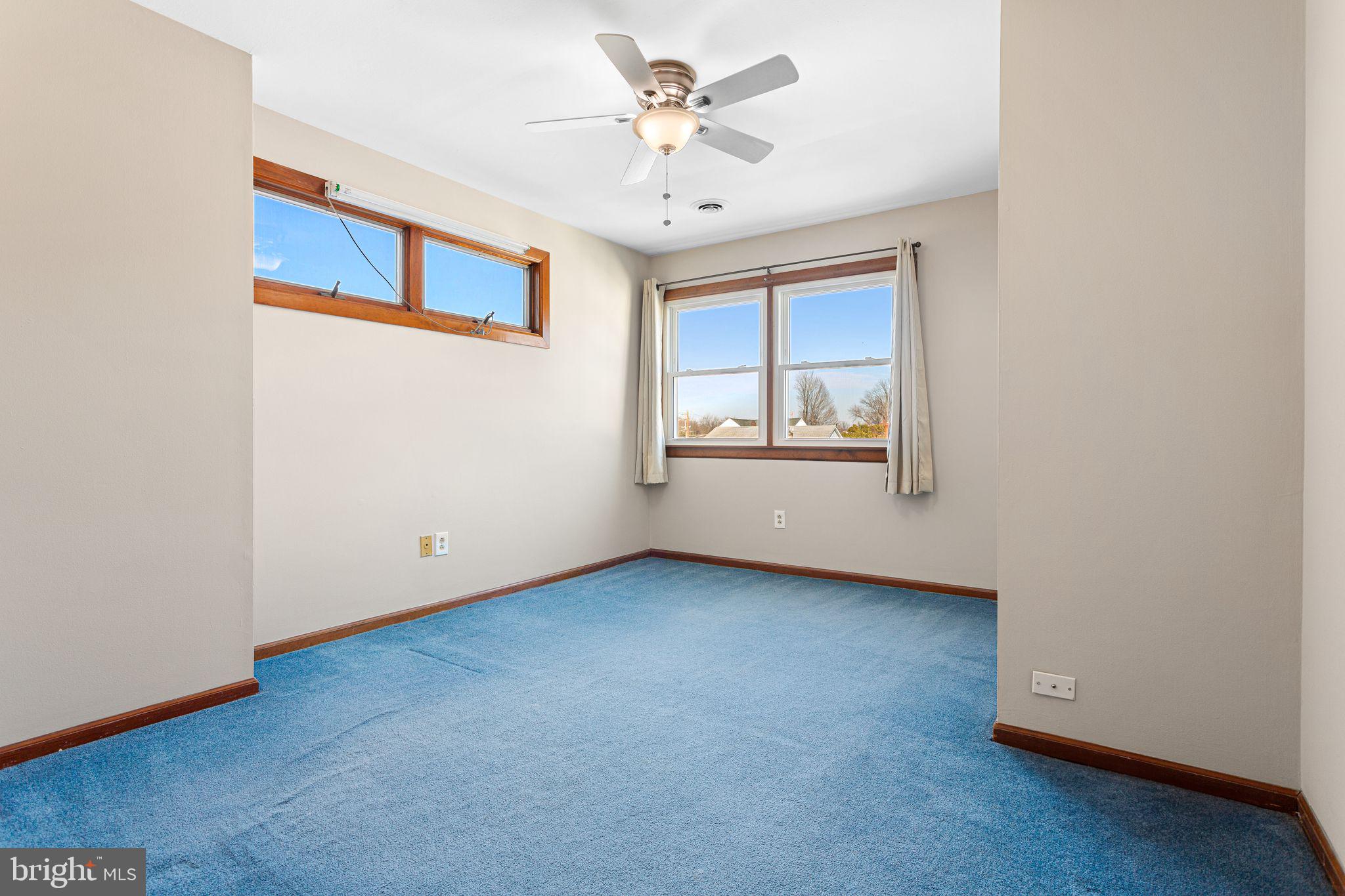 2623 Knights Road Bensalem, PA 19020 - Photo 33 of 50 an empty room with chandelier fan and windows