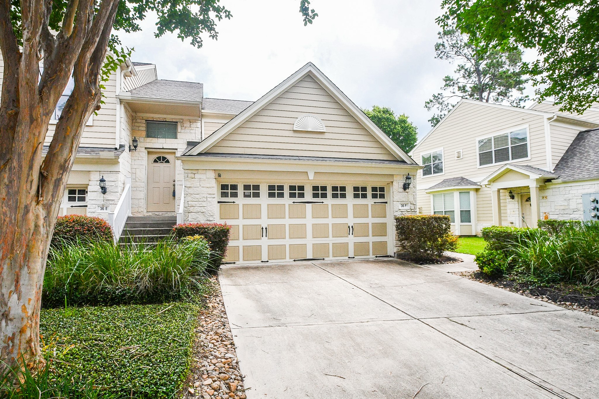 13600 Breton Ridge Street, Unit 36F Houston, TX 77070 - Photo 5 of 38 Rear exterior showcasing a private entrance and peaceful green space.
