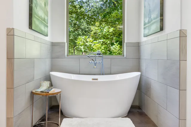 a white bath tub sitting in a bathroom