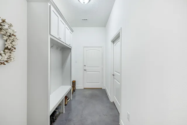 a view of a hallway with closet