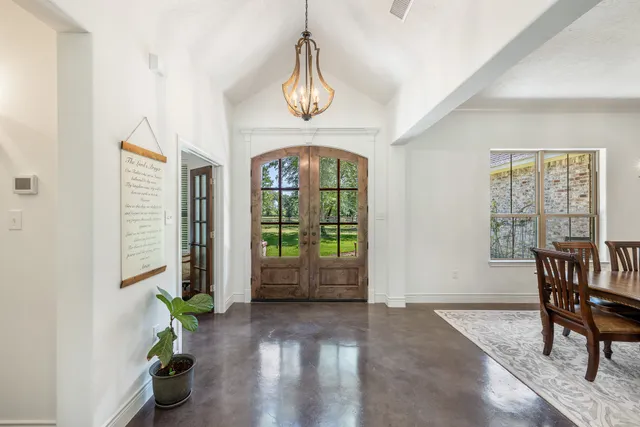 a view of an entryway with wooden floor