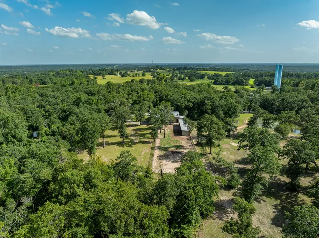 a view of a swimming pool with a yard