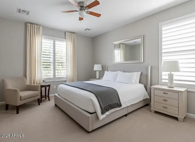 a spacious bedroom with a bed and a couch