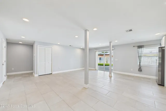 a view of kitchen with refrigerator sink and stove