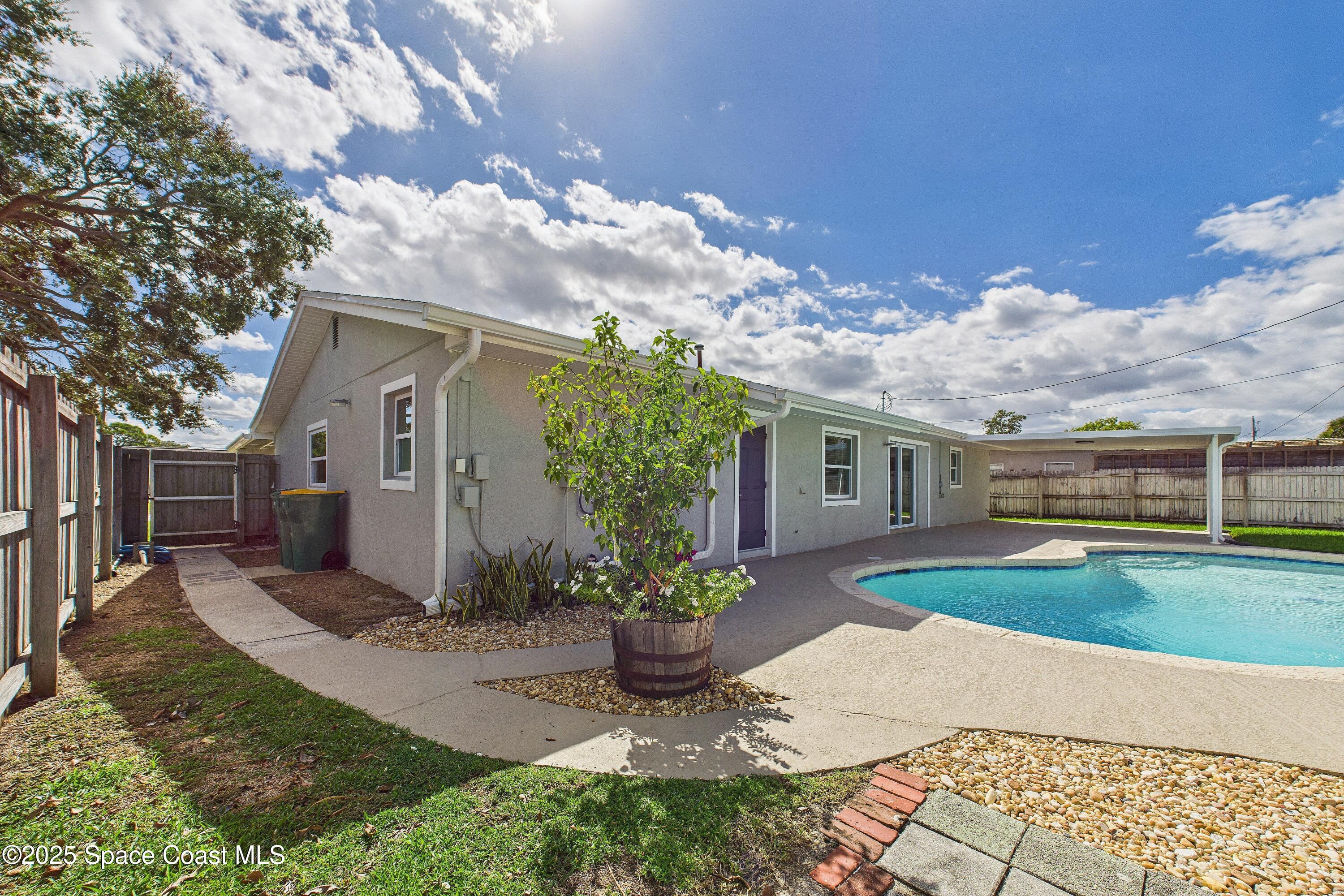 1500 Dorsal Street Merritt Island, FL 32952 - Photo 2 of 56 a front view of a house with garden